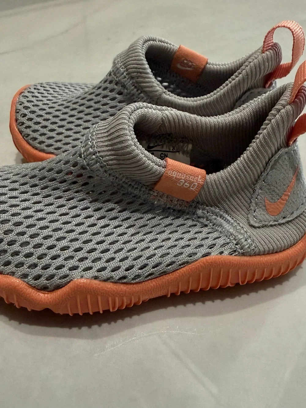 Nike Kids Grey Mesh Slip-On Sneakers with Coral Accents